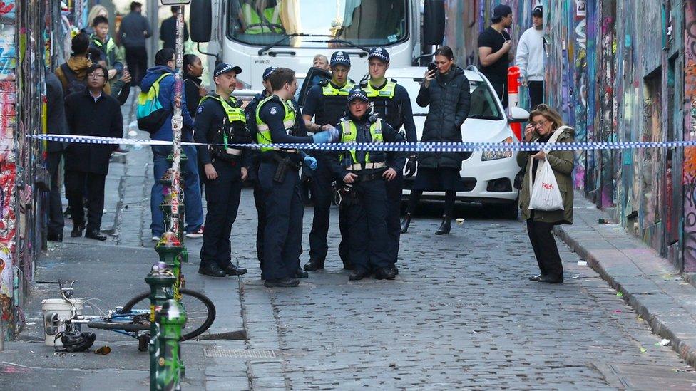 Police at the scene of Mr Dick's arrest in a central Melbourne laneway