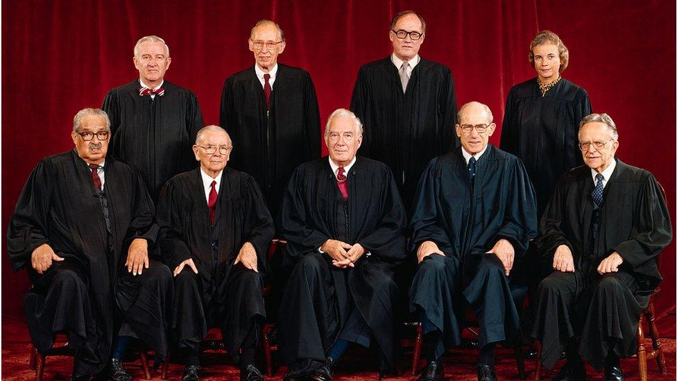 Rehnquist and Mrs O'Connor stand beside each other (back row right) in this 1982 photo