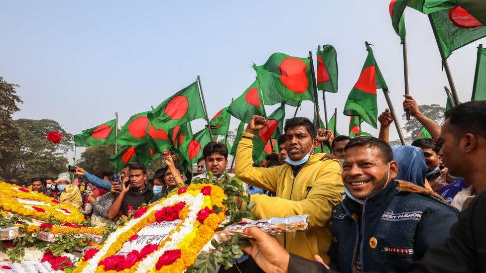 People gather to pay their respect at the national memorial of the 1971 Bangladesh independence war's martyrs to mark the country's Victory Day in Savar on December 16, 2020.