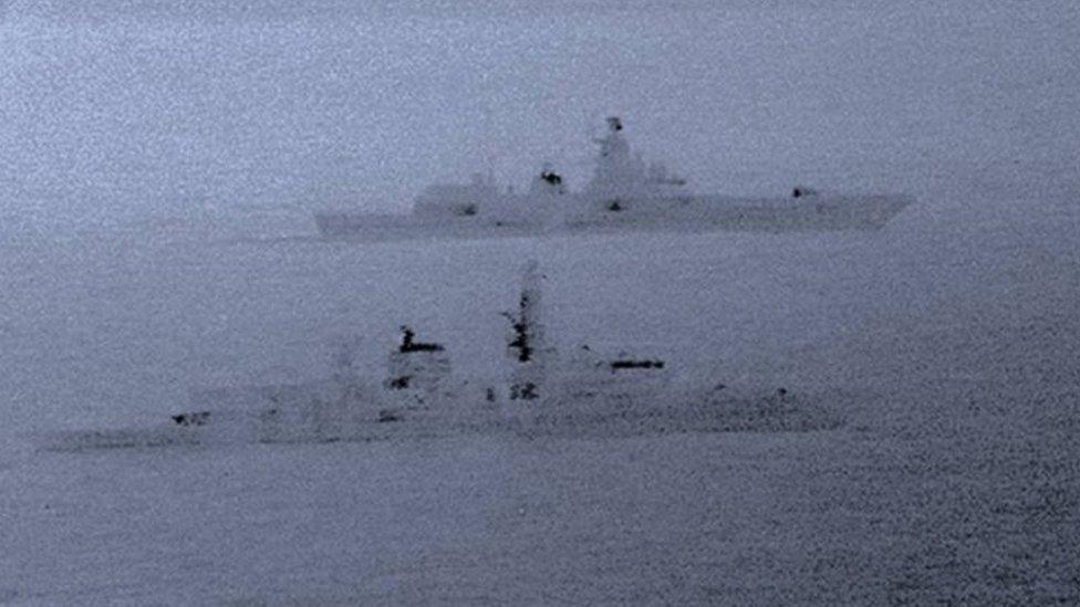 HMS St Albans (foreground) escorts the Russian vessel through the North Sea. Photo: 25 December 2017