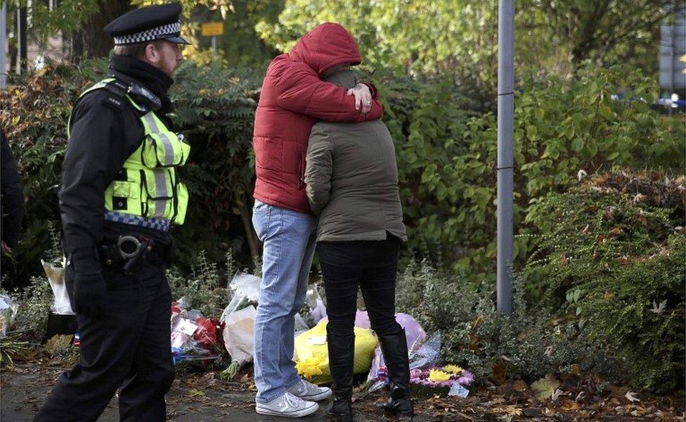 Mourners near tram derailment site