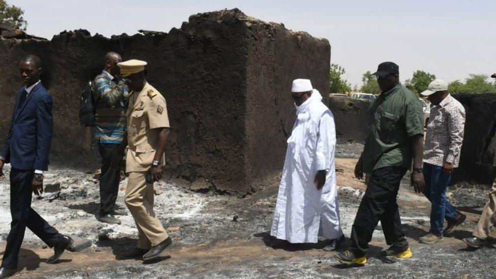 President Ibrahim Boubacar Keita inspects the damage after an attack by gunmen on Fulani herders in Ogossagou, Mali 25 March 2019