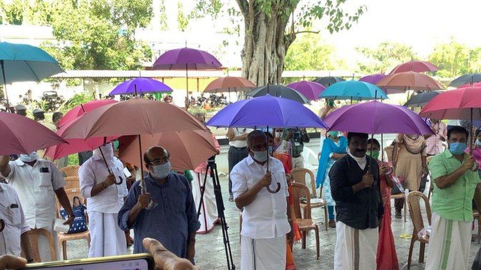 People-in-India-holding-umbrellas.