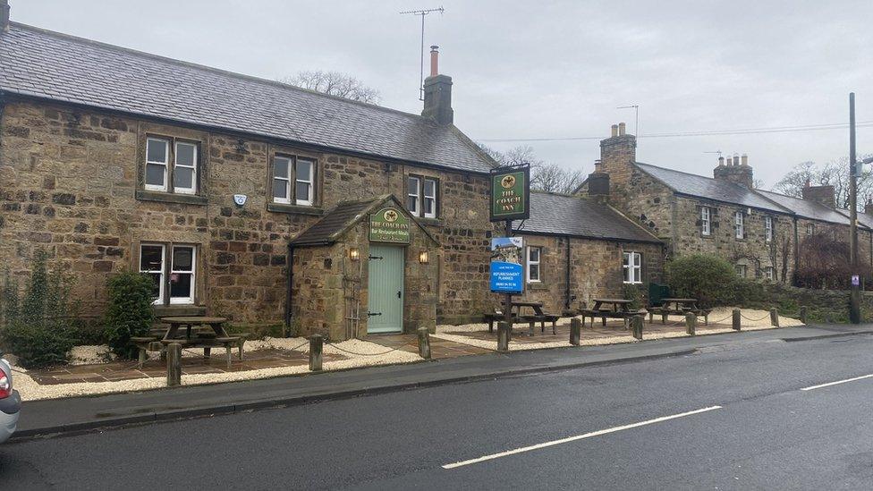 The outside of the Coach Inn showing a refurbishment sign