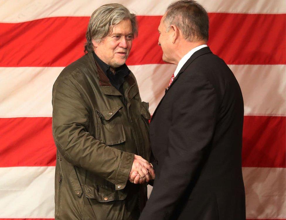 Bannon shaking hands with Moore