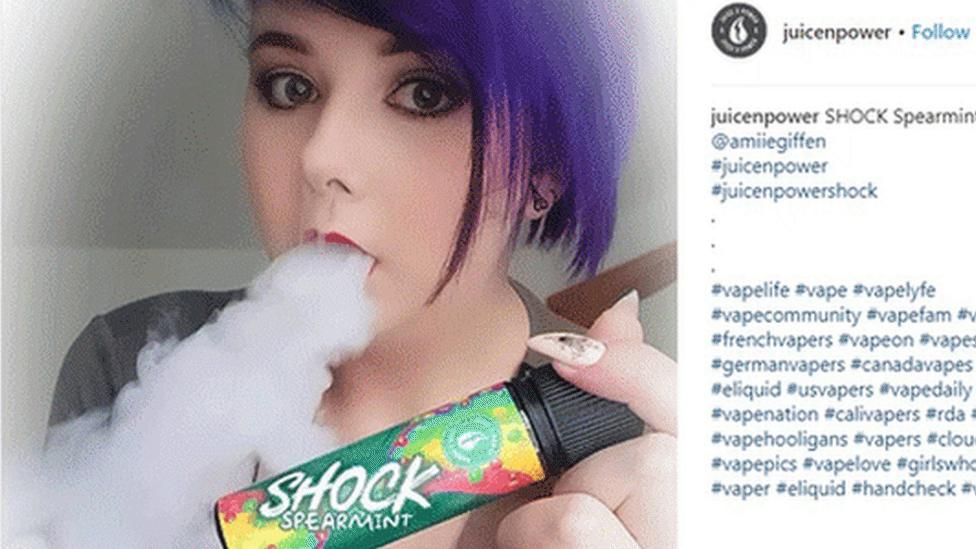 Young woman vaping