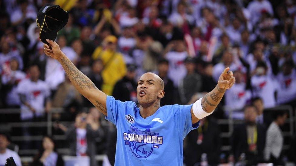 Former NBA superstar Stephon Marbury celebrates after his team, the Beijing Ducks, won their first-ever Chinese championship in Beijing