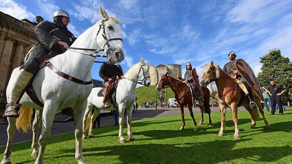 The "warriors" on horseback at the start of the march