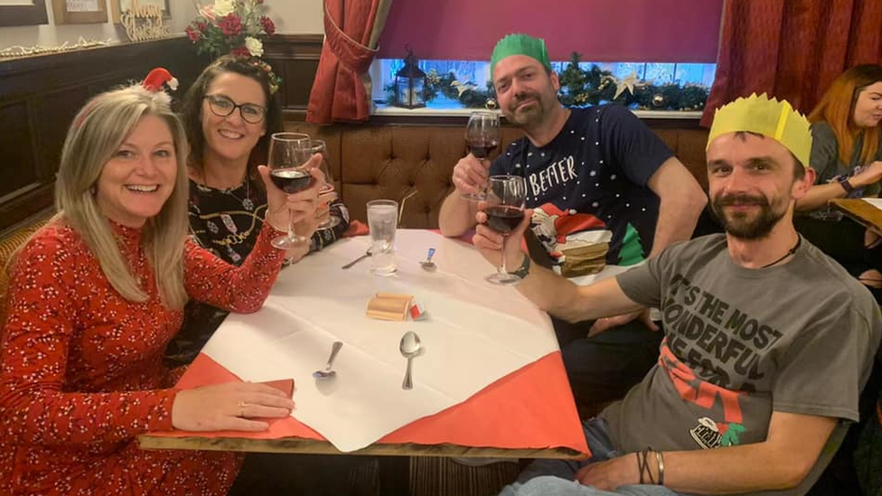 People enjoying Christmas food in the Greyhound Inn