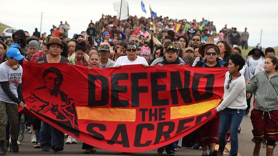 Native Americans march to the site of a sacred burial ground that was disturbed by bulldozers building the Dakota Access Pipeline (DAPL), near the encampment where hundreds of people have gathered to join the Standing Rock Sioux Tribe's protest of the oil pipeline slated to cross the nearby Missouri River, September 4, 2016 near Cannon Ball, North Dakota