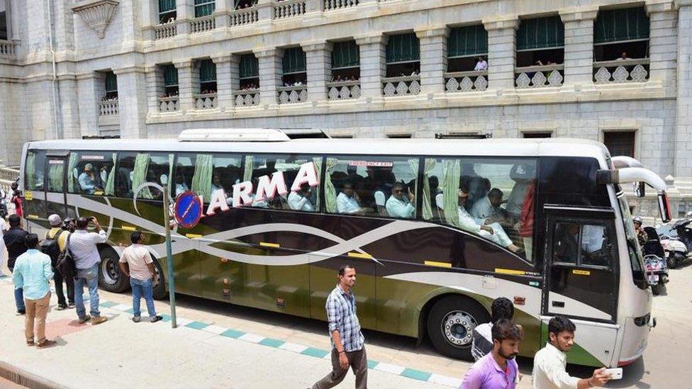 Congress lawmakers sitting in a bus after staging a protest