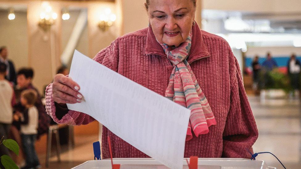 Woman voting in Russia