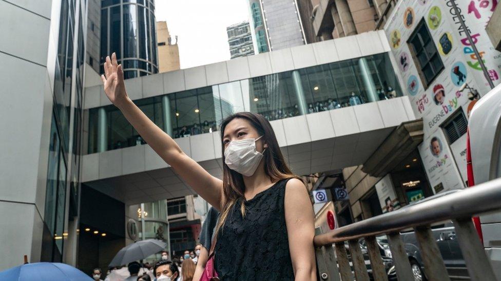 Pro-democracy supporters shout slogans in the Central district