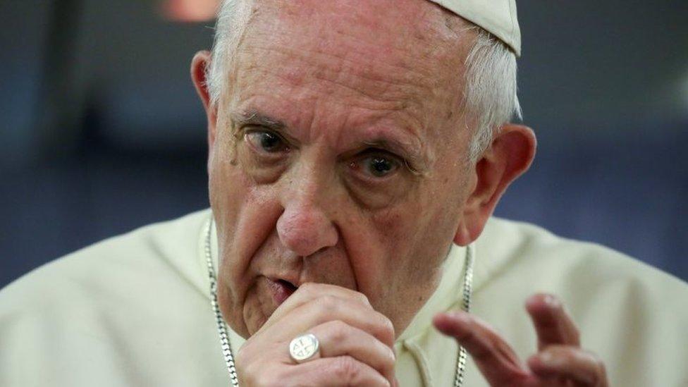 Pope Francis gestures during a news conference on board of the plane during his flight back from a trip to Chile and Peru, 22 January 2018.