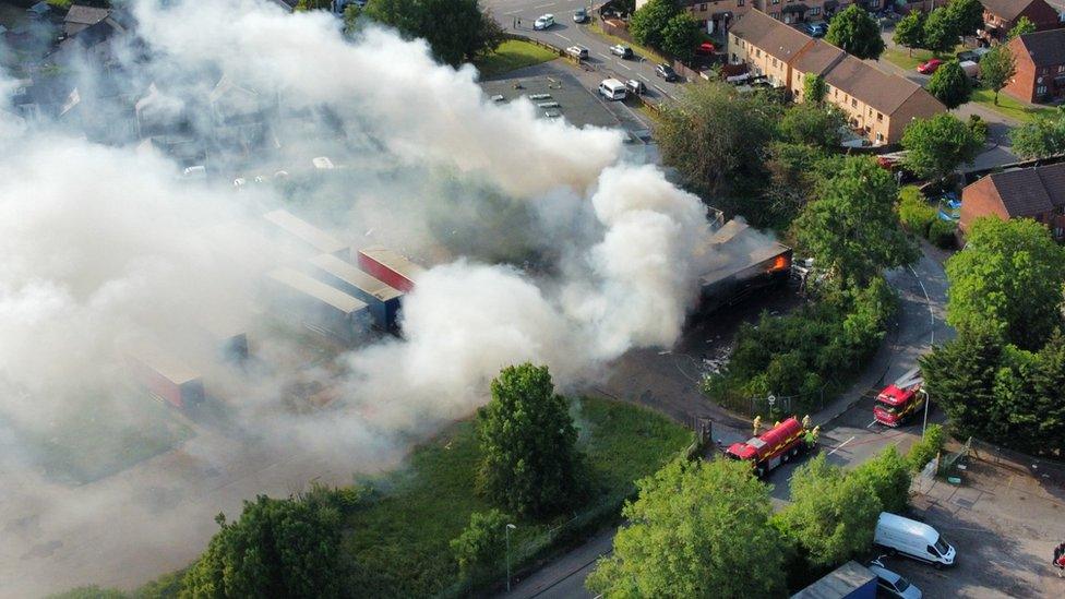 Smoke billowing from industrial estate