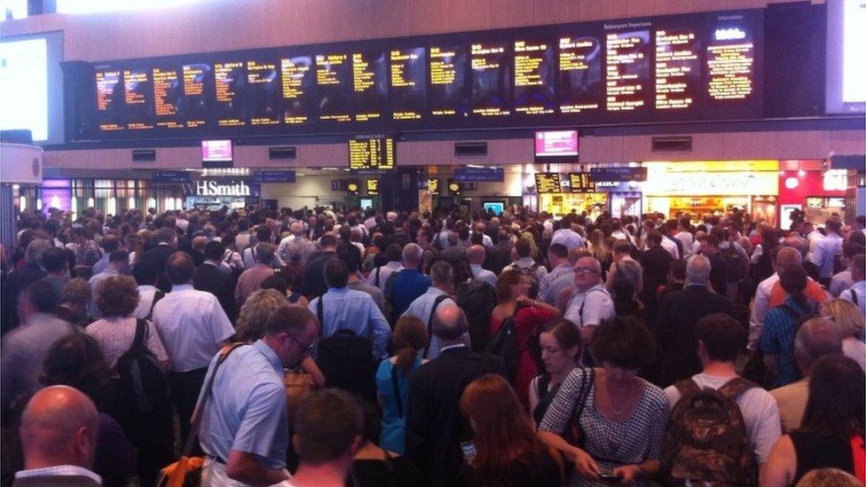 Passengers waiting at Euston station