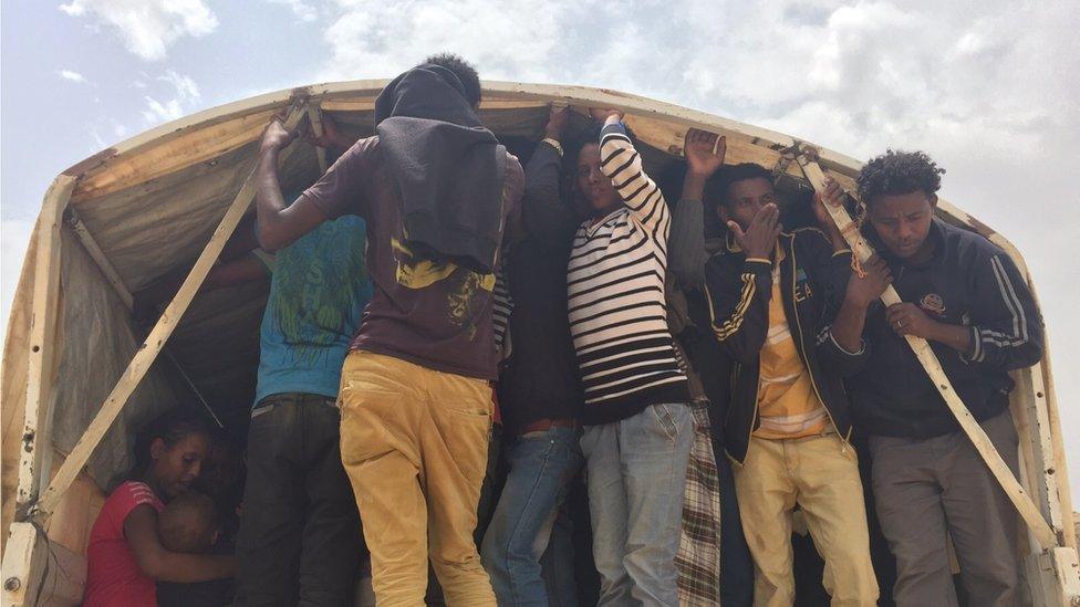 Refugees being picked by a unhcr lorry from the border to the screening center