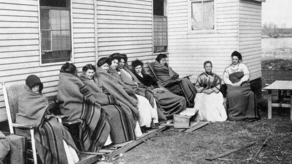 Mary Mallon is pictured here, fourth from R, in quarantine on Long Island Sounds