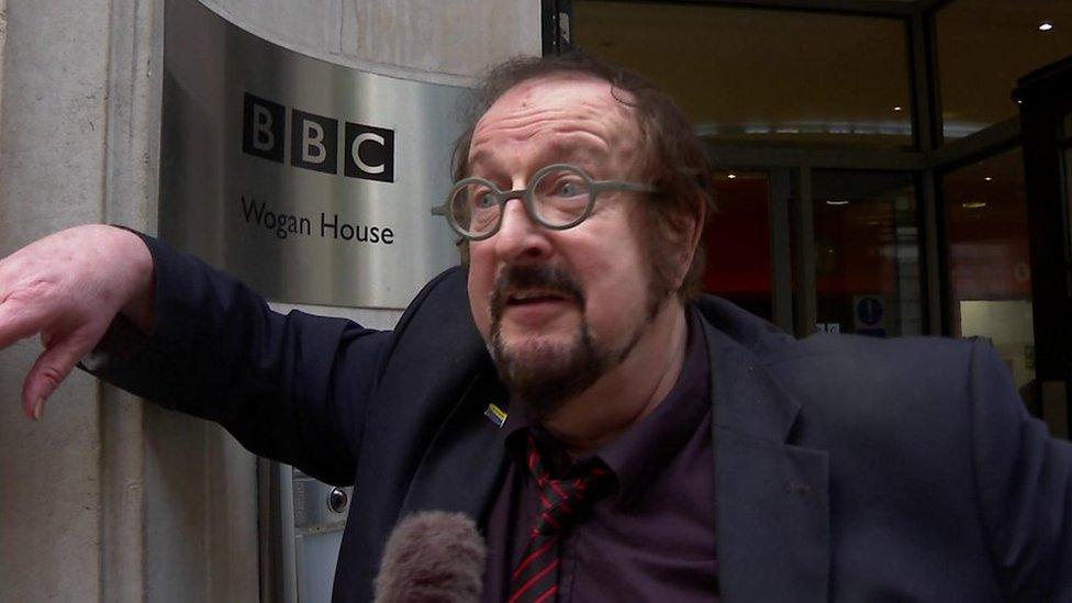 Steve Wright leaning on BBC Wogan House