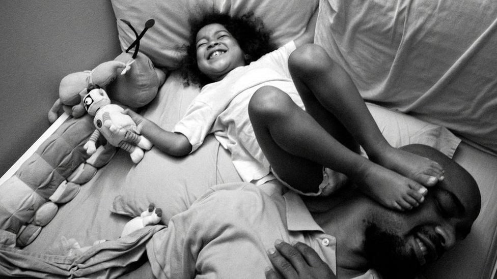 Bedtime shenanigans with Carlos Richardson and his daughter Selah. Harlem, NY. August 2