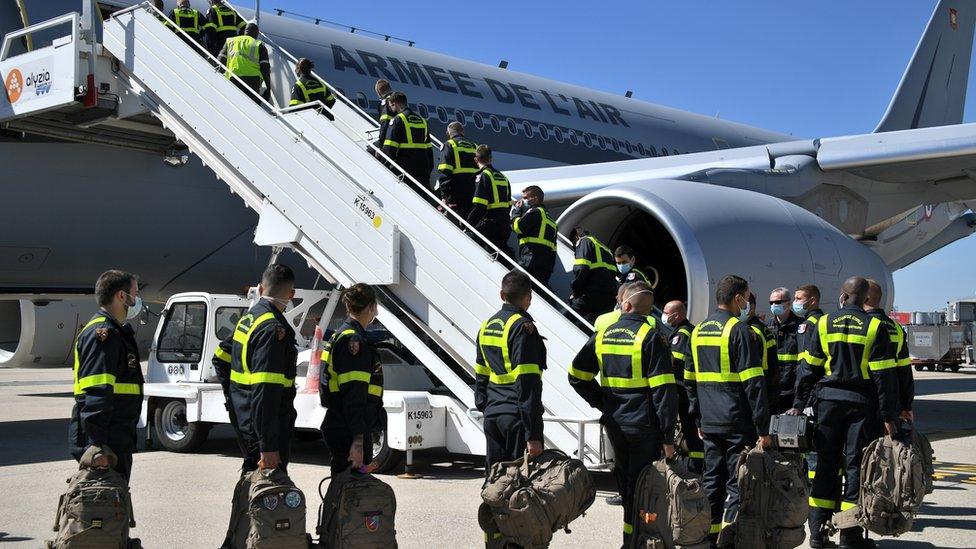 Rescuers getting on plane heading to Beirut