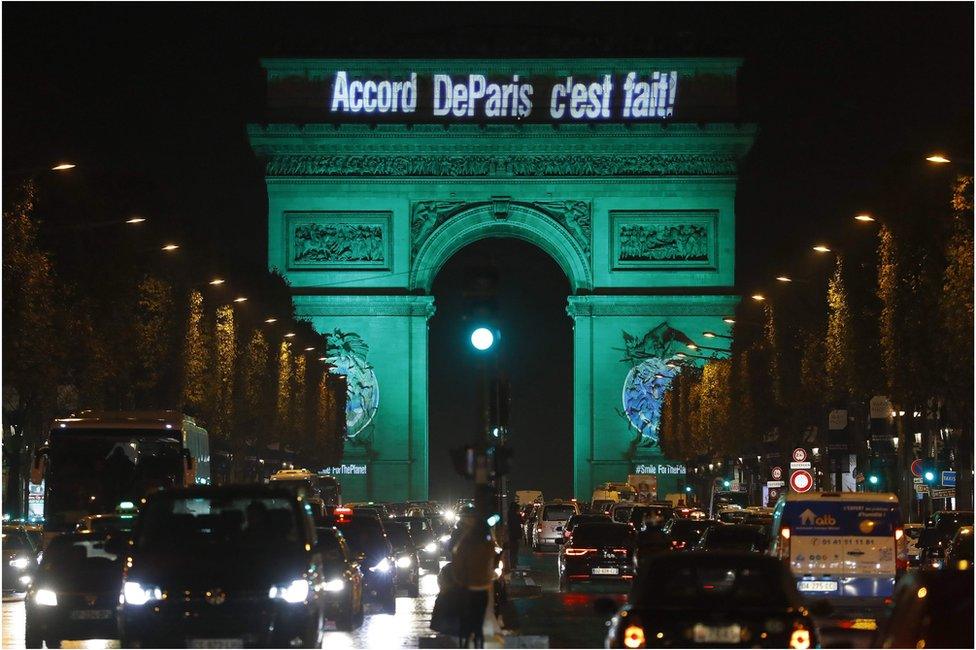 This file photo taken on November 4 2016 shows The Arc de Triomphe illuminated with the words "The Paris accord is done" in Paris, to celebrate the first day of the application of the Paris climate accord