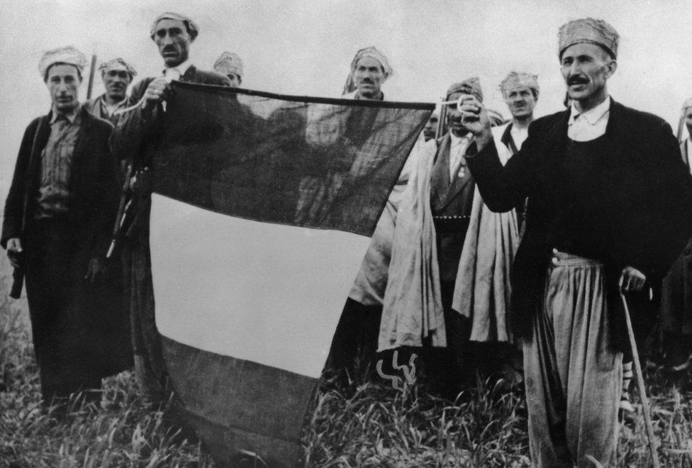 French troops with a recaptured tricolour during the Algerian War of Independence, 1956.