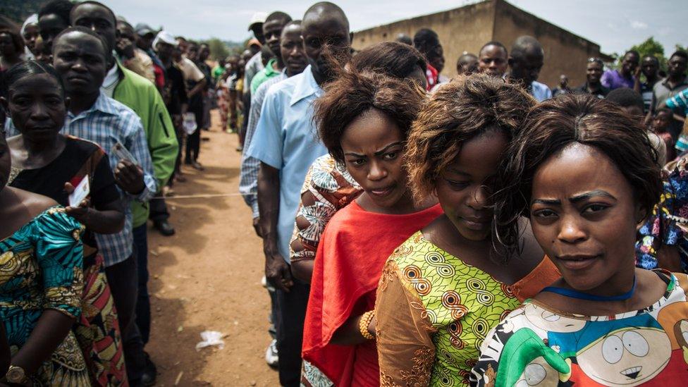 Voters queue to cast their ballots at a symbolic polling station on December 30, 2018, at Malepe Stadium in Beni,