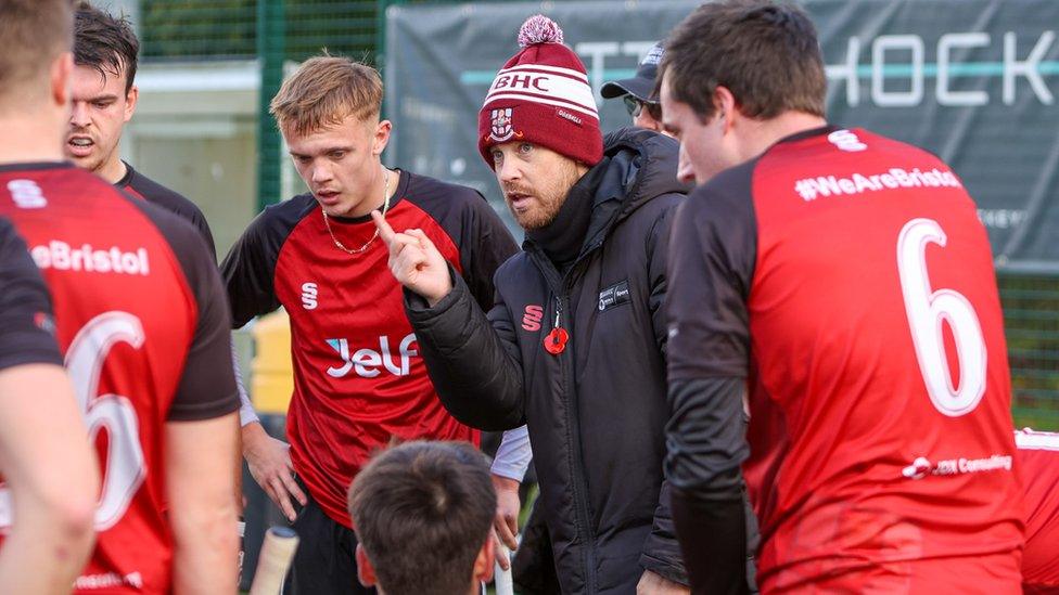 Ben Dudley talking to hockey players