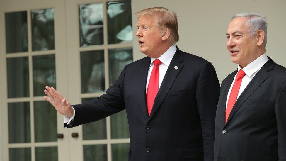 US President Donald Trump and Prime Minister of Israel Benjamin Netanyahu walk through a colonnade prior to an Oval Office meeting at the White House March 25, 2019 in Washington, DC.