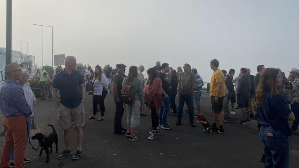 People gathering on Saltburn promenade to protest against the creation of 100 parking spaces there