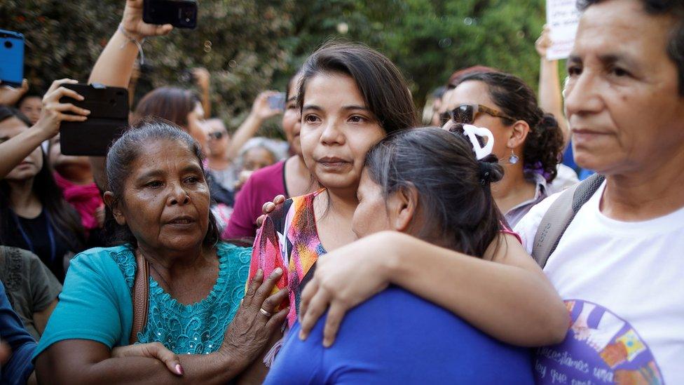 Imelda Cortez reacts as she leaves a court of law after being acquitted of attempted aggravated murder under the country's abortion law, in Usulutan, El Salvador