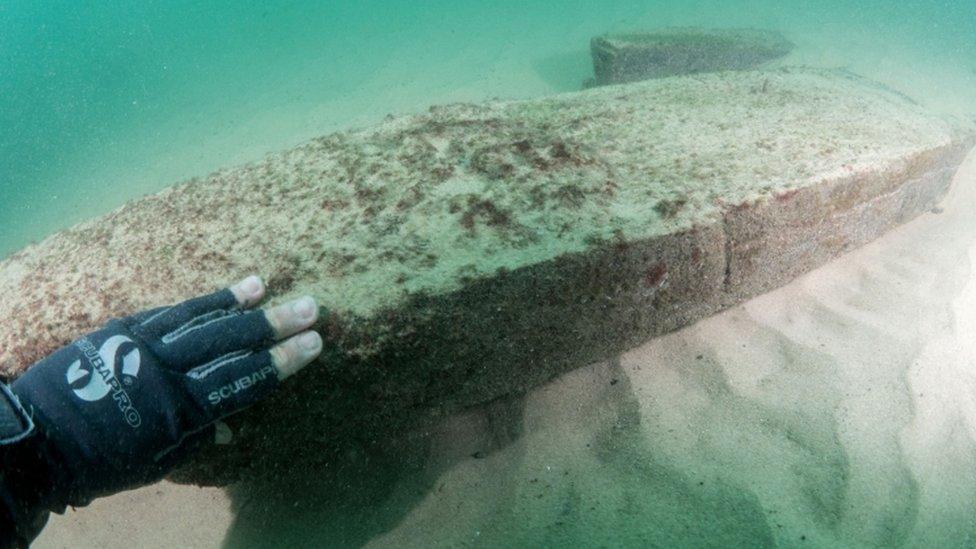 A diver works at the scene of a centuries-old shipwreck near Portugal