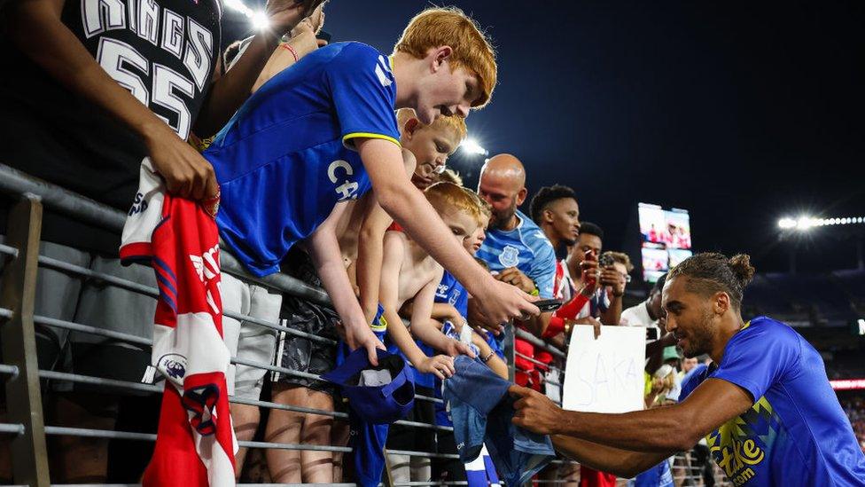 Fans meet Arsenal's Gabriel Magalhaes after the match against team's game against in Baltimore, Maryland in the United States