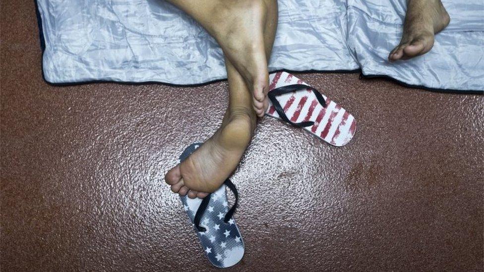 A Cuban migrant's flip flops can be seen inside the border control building in Penas Blancas, Costa Rica on 21 November 2015