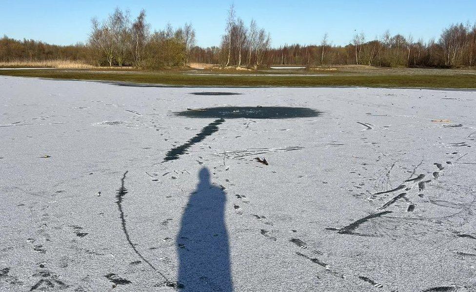 Footprints on frozen lake