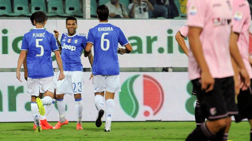 Juventus players celebrate a goal against Palermo