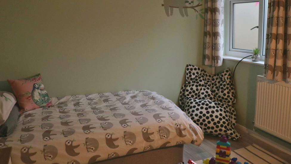 bedroom with beanbag chair in the corner