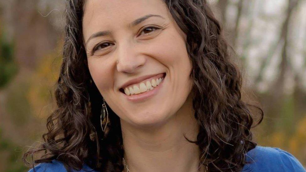 Alison Bernstein smiles in headshot