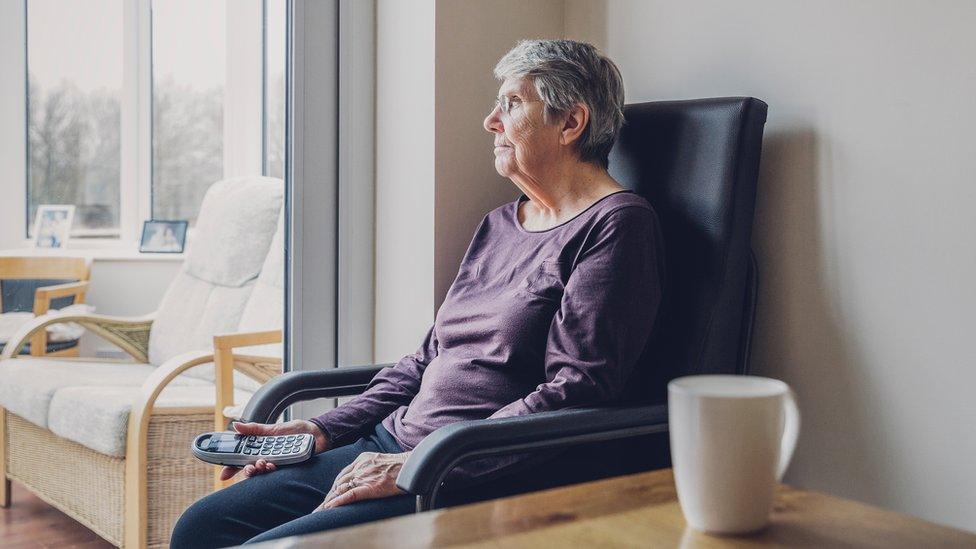 Woman sitting alone at home