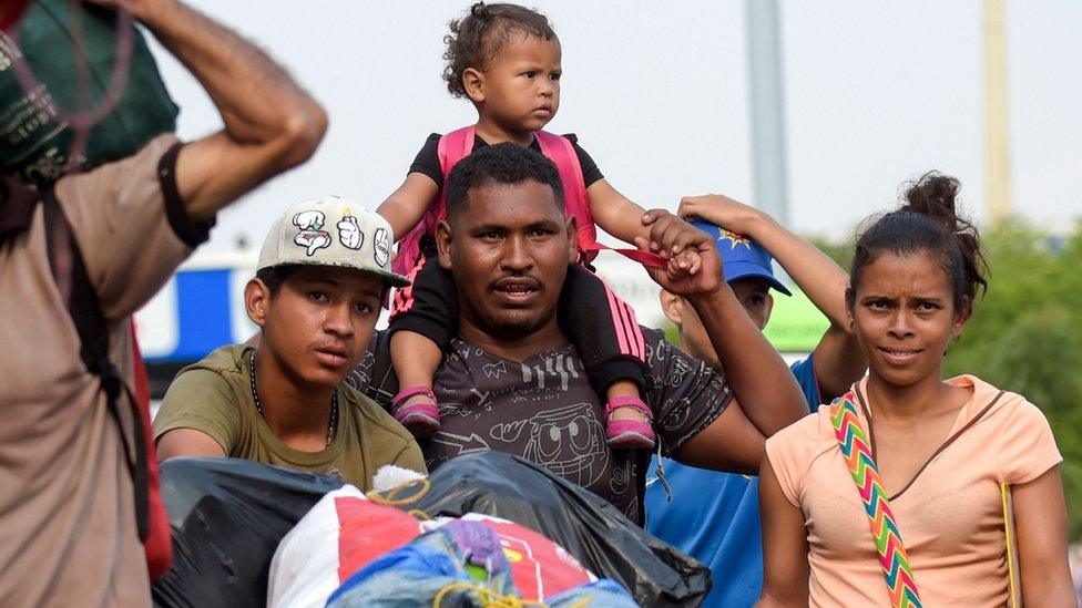 People cross the Simon Bolivar International Bridge on the border between the Colombian city of Cucuta and the Venezuelan Tachira, on February 5, 2019