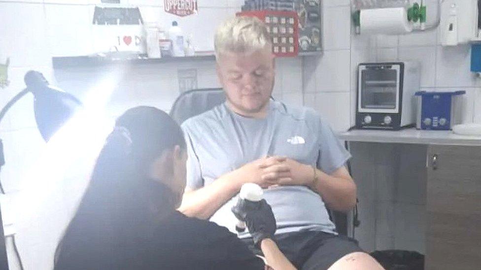 Man getting tattoo