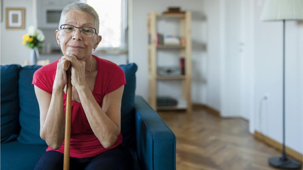 Stock shot of woman on couch