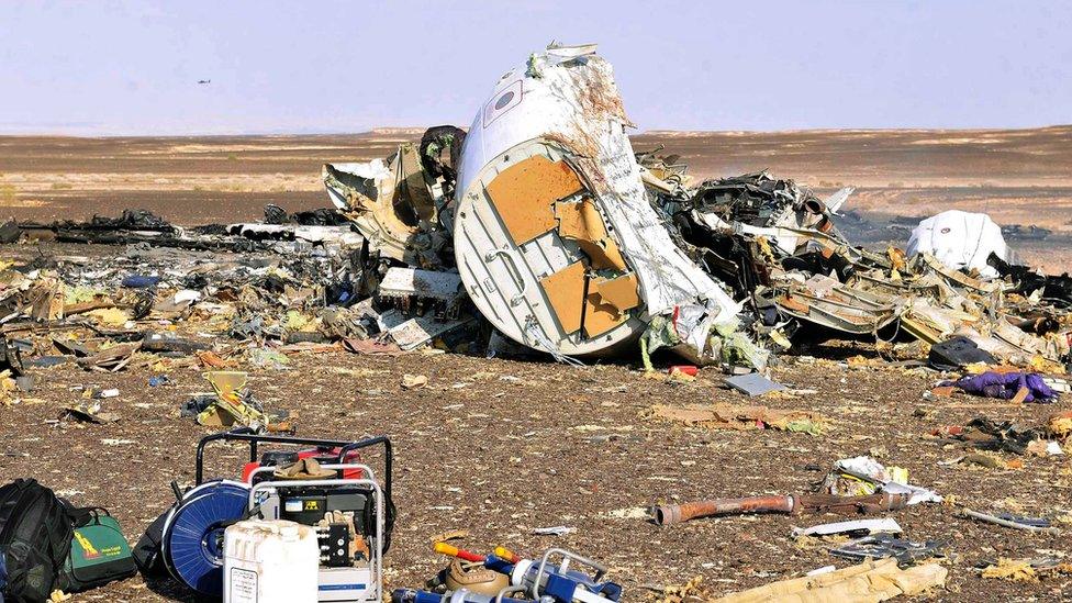 Debris from crashed Russian jet lies strewn across the sand at the site of the crash, Sinai, Egypt, 31 October 2015.