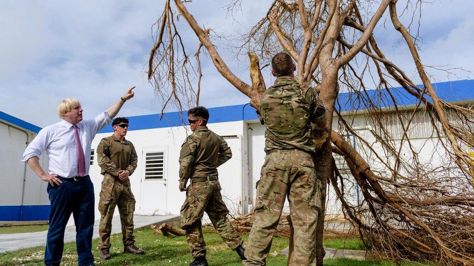 Boris Johnson talks to Royal Engineers as they remove a tree destroyed by Hurricane Irma