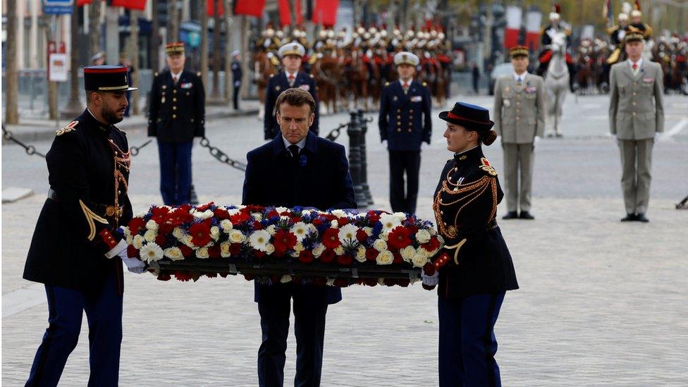 France's President Emmanuel Macron lays a wreath at the Tomb of the Unknown Soldier at the Arc de Triomphe