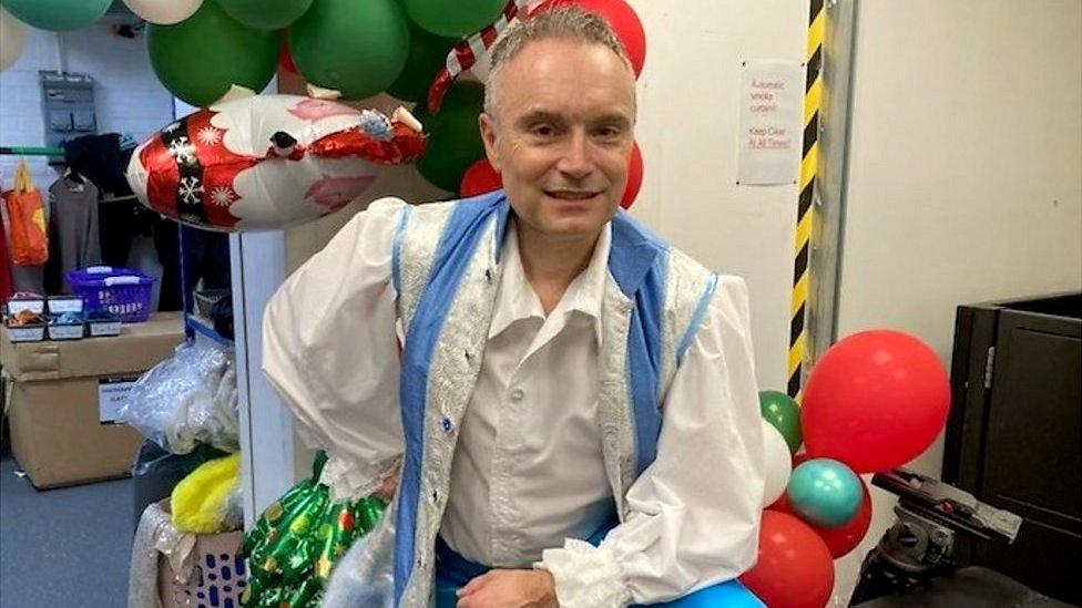 David Allard poses in panto outfit