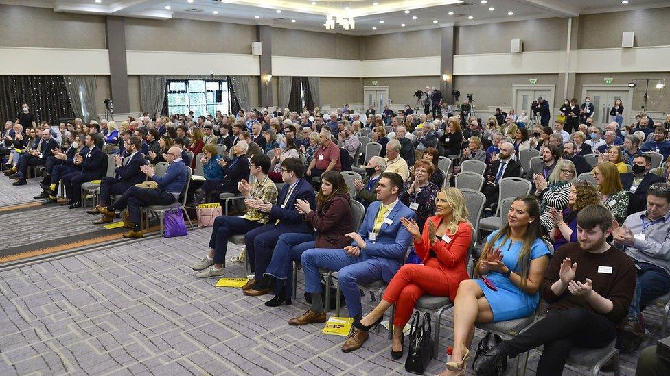 Party members gathered at a Belfast hotel