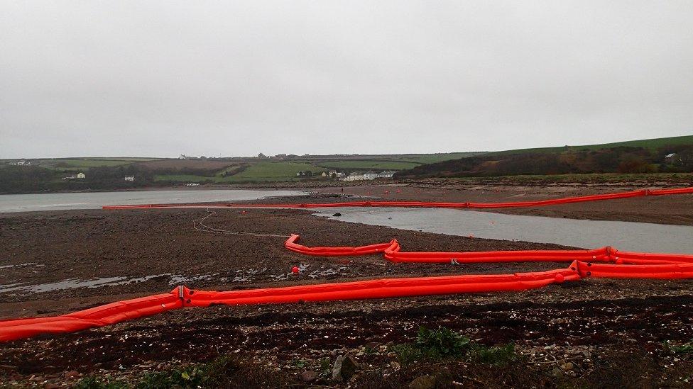 Booms used to contain the spill are due to be removed