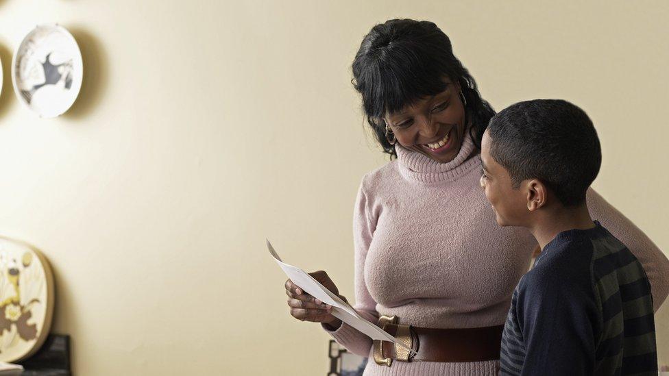 Mother and son with exam results